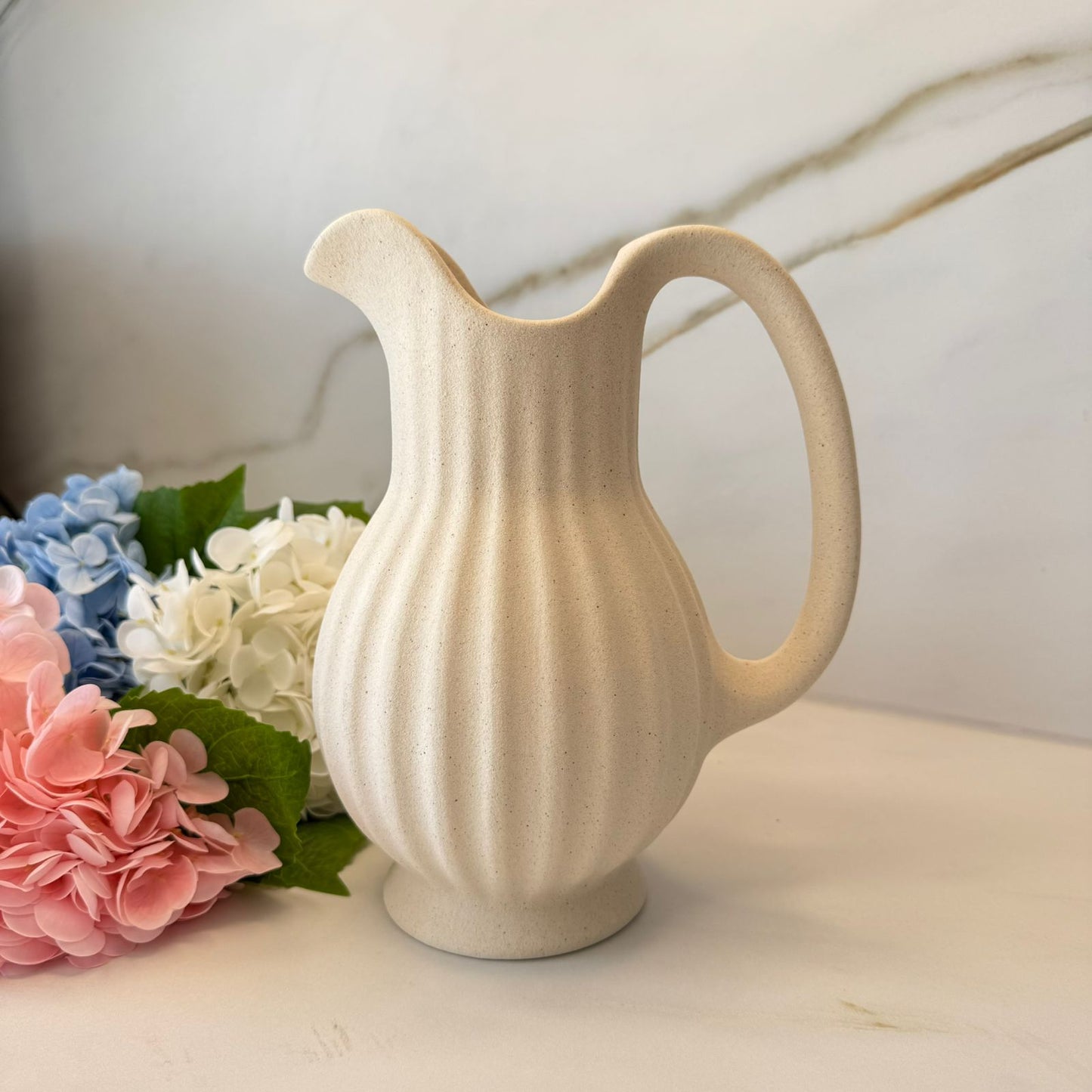 گوڵدان بە کۆزەی کێشی ریپڵ