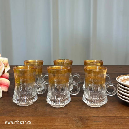 کوپێکی چای شووشەی لێواری زێڕین و سێتی ساوسێر