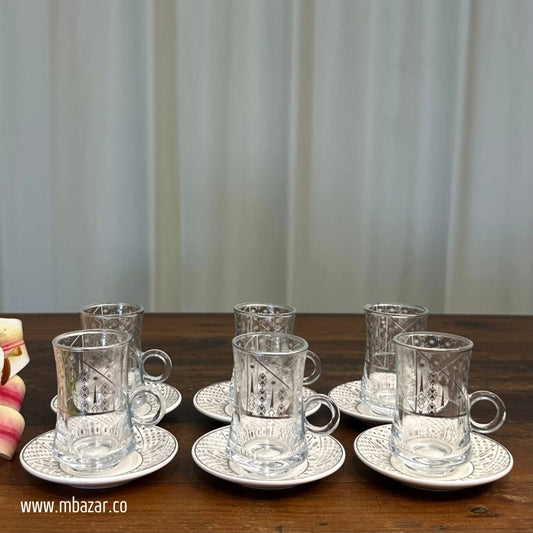 کوپێکی چای شووشەیی لێواری زیو و سێتێکی ساوسێر